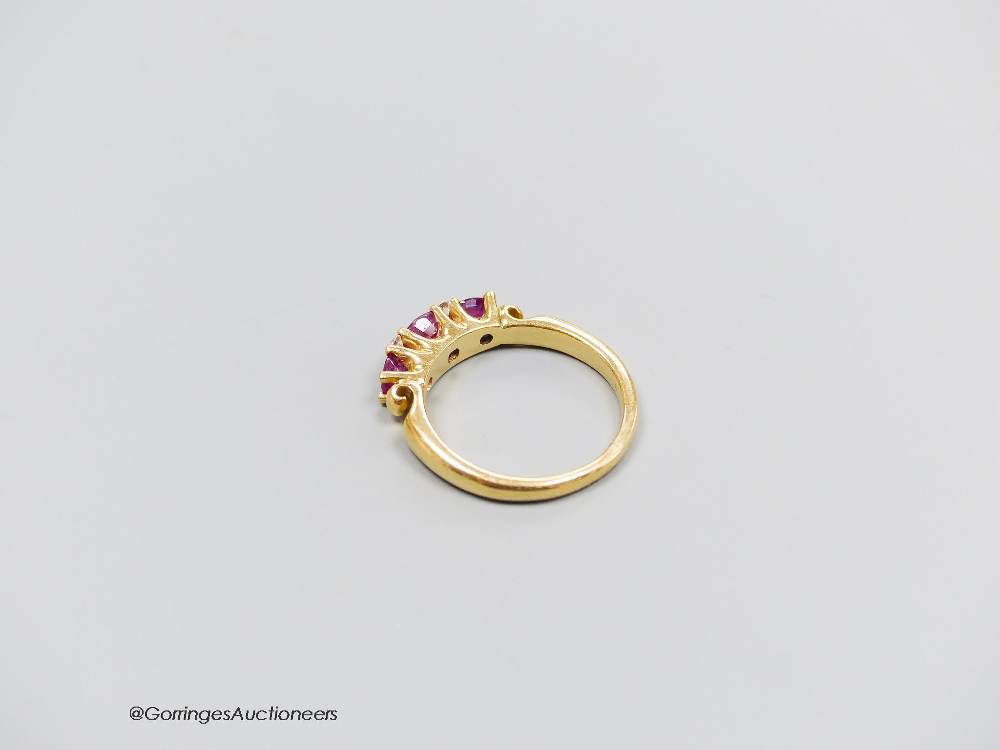 A 18ct gold ruby and diamond ring, size M, gross 5g.